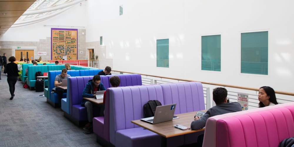 Rainbow-coloured seating booths in Merchant Venturers Building