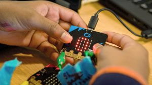 A microbit plugged into a laptop