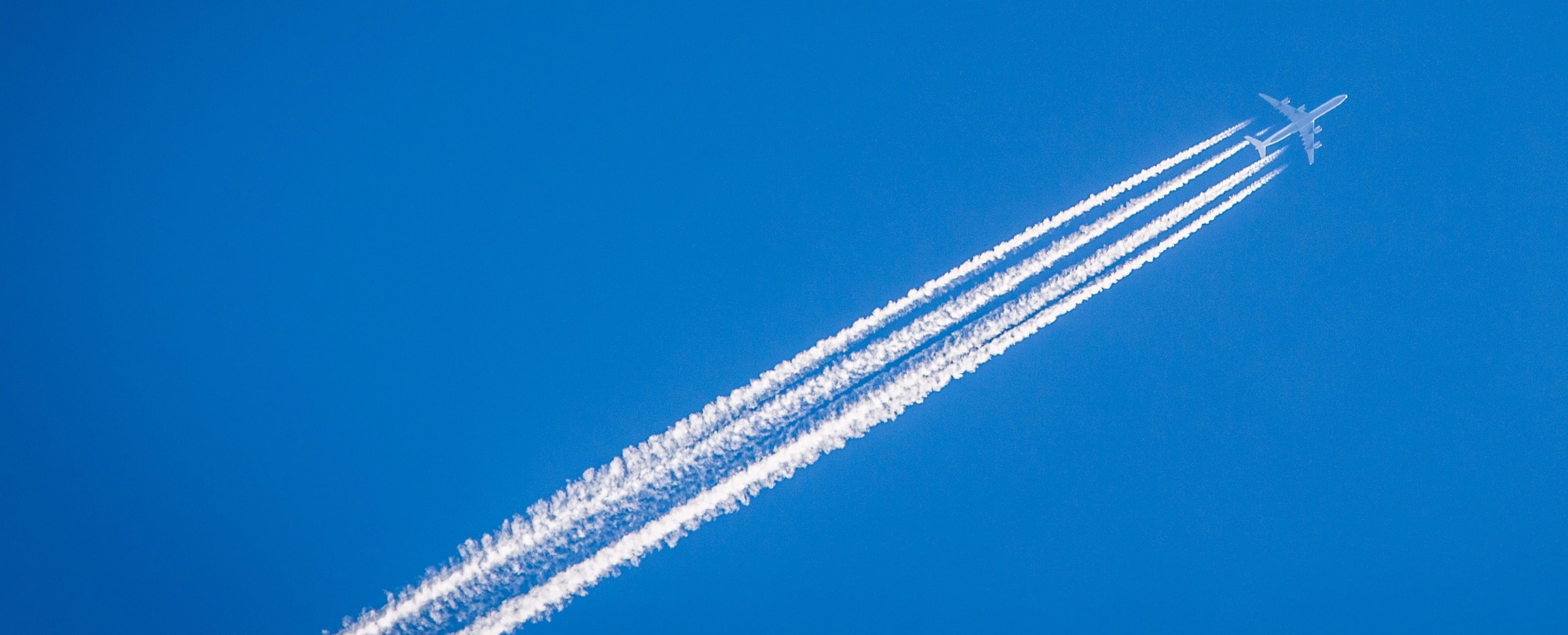 Contrails forming from the exhaust fumes of the aircraft